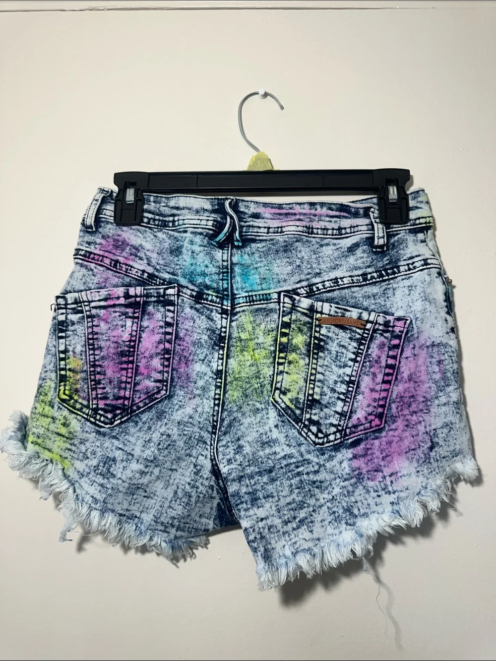 High-Rise Acid-Wash Denim Cutoff Shorts in Multicolor Splatter